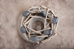 Six dark colored eggs on a plate