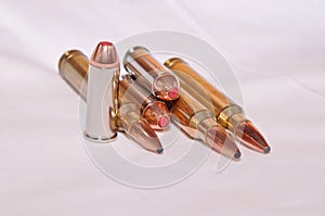 Six different bullets, a .300 Winchester Magnums for a rifle and a .44 specials for a handgun
