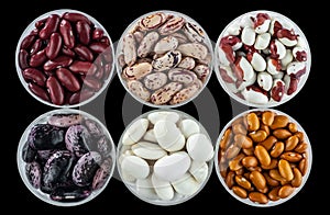 Six different varieties of beans in round glassware