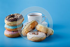 Six donuts on blue shadeless background