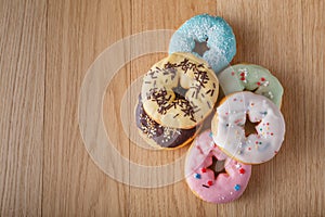 Six donuts on wood table