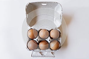 Six eggs pack  on white background