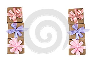 Six festive boxes with gifts tied with satin ribbon on a white background.