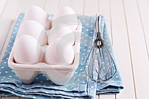 Six fresh eggs in egg holder