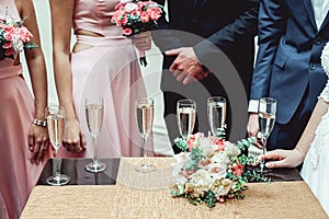 Six glasses with white wine on a table. wedding party.