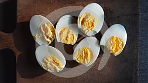 Boiled eggs on cutting board background