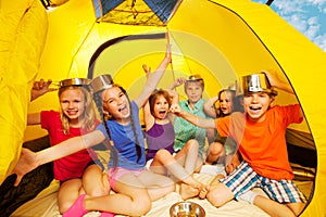 Six kids having fun in a tent