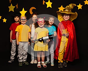 Six kids in stargazers costumes with telescope