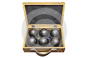 Six metal balls placed in a old wooden box, used in game petanka, isolated on a white background with a clipping path. photo