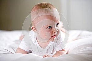 Six month old baby with staring with blue eyes