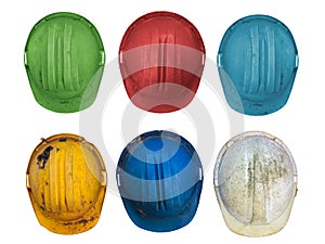 Six old colorful construction helmets