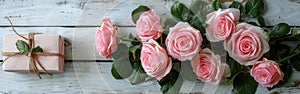 Six Pink Roses and Giftbox on Rustic White Wooden Background - Romantic Floral Gift Idea for Any Occasion