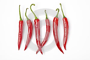 Six Red Hot Chili Peppers In A Row On White Backg