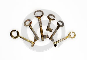 Six rusty keys with cut through circled pinches photo