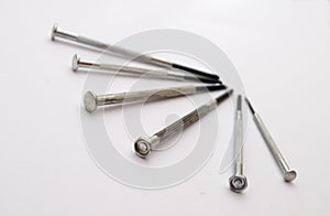 Six screwdrivers rigged in some form on a white background