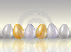 A six shining dyed in metallic gold, silve, platinum colors chicken eggs on light gray background with reflaction. Healthy food. D