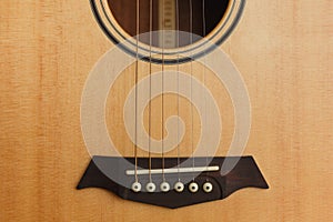 six-string acoustic guitar on a red background