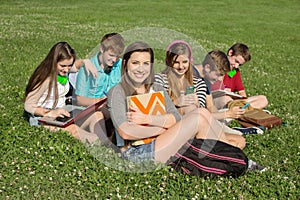 Six Teens Studying Outdoors