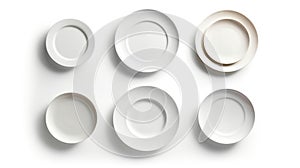 Six white ceramic plates of different sizes arranged on a white background