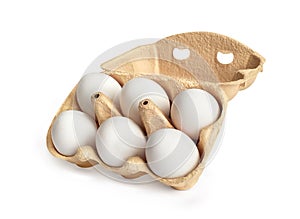 Six white eggs in a package