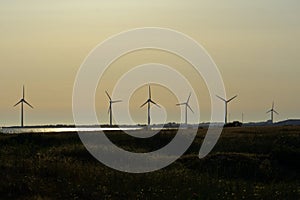 Six wind turbines in the distance