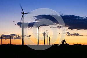 Six wind turbines operating at dusk near Dodge Center Minnesota