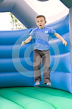 Six year old boy bouncing