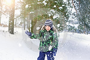 The six-year-old boy costs under a snow shower