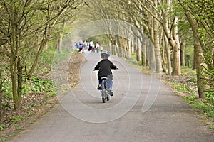 Six year old boy riding his bike