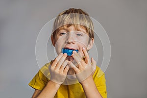 Six-year old boy shows myofunctional trainer. Helps equalize the growing teeth and correct bite, develop mouth breathing
