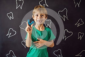 Six-year old boy shows myofunctional trainer. Helps equalize the growing teeth and correct bite, develop mouth breathing photo