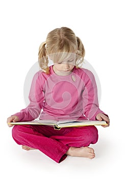 Six Year Old Girl Reading a Book