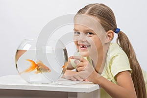 Six year old girl very happy donated her gold fish