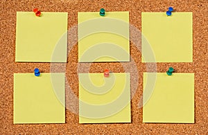 Six Yellow Post-it Sticky Notes on a cork board