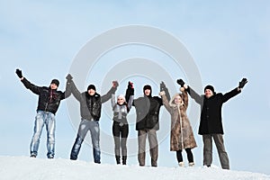 Six young people hold on hands