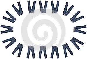 Sixteen pairs of dark blue jeans isolated on white background. Close up shot. Jeans encircle copy space in the middle. Clothing,