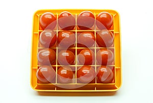 Sixteen Red Cherry Tomatoes in a Square