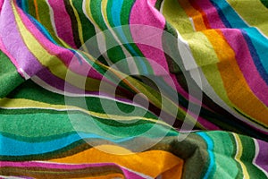 Sixties style bright and colourful crumpled striped cotton background