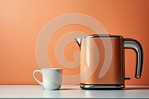 sixties style orange electric kettle and cup of coffee