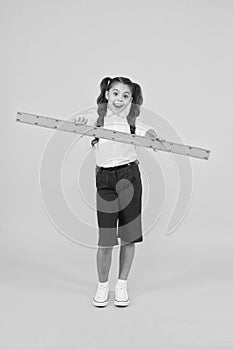 Sizing and measuring. School student study geometry. Tell me about distance. Kid school uniform hold ruler. Pupil cute