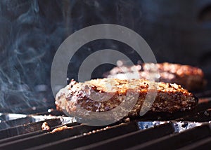 Sizzling hamburgers on the grill