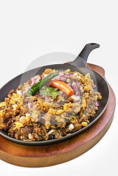 Sizzling Sisig, Filipino dish made with pork front view