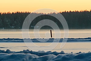 Skandinavien winter sunset frozen lake photo