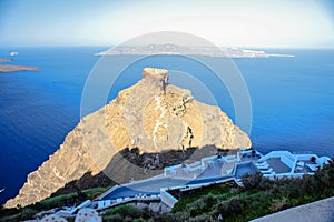 Skaros rock in Santorini against blue sea as a