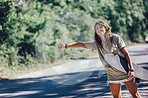 Skateboard girl hitchhiking and stopping car with thumbs up gesture