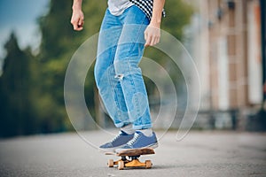 Skateboard man practices to ride on asphalt, learns tricks