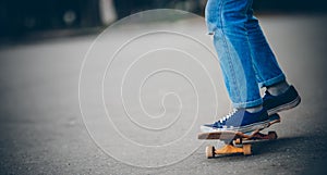 Skateboard man practices to ride on asphalt, learns tricks
