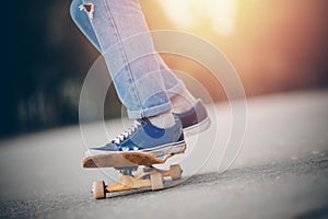 Skateboard man practices to ride on asphalt, learns tricks