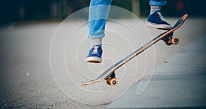 Skateboard man in shoes and jeans getting ready to jump kickflip olli from steps