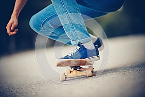 Skateboard man in shoes and jeans getting ready to jump kickflip olli from steps